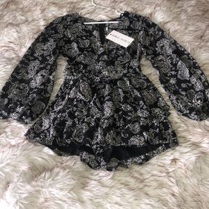 Saints + Secrets B&W Tiered Deep V Romper Holiday